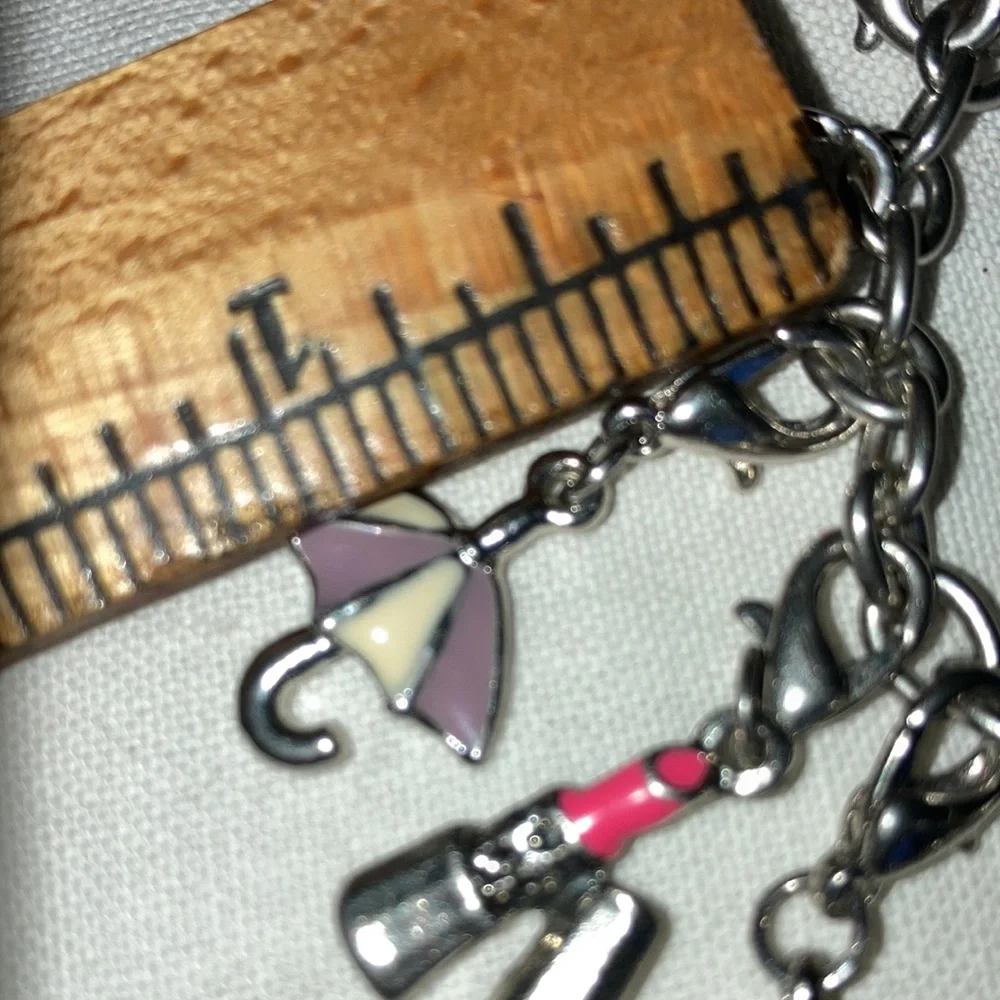 VTG st charm bracelet loaded w/cute bright enameled colors, 8” chain. $45 - Picture 7 of 7